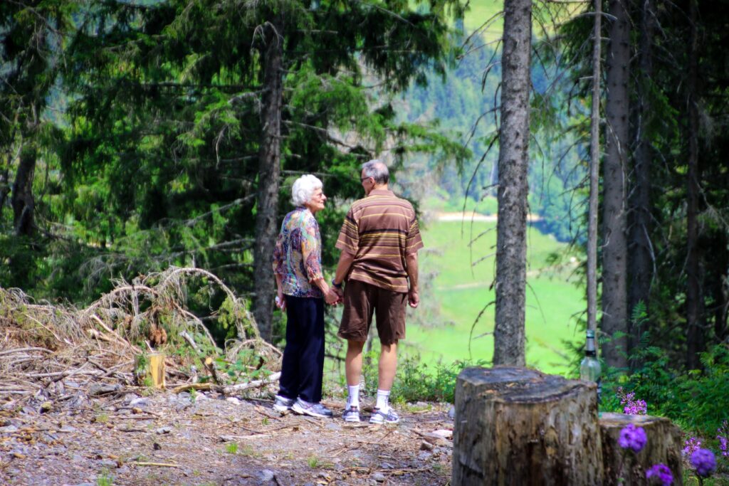 Senior Couple Holding Hands in a Forest